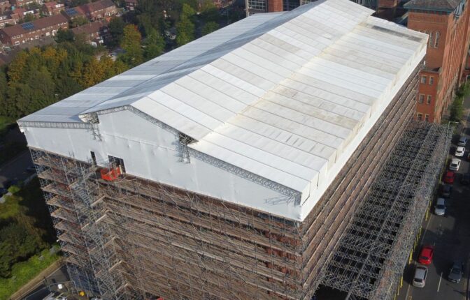 An aerial view of Houldsworth Mill's roof covered in scaffolding.