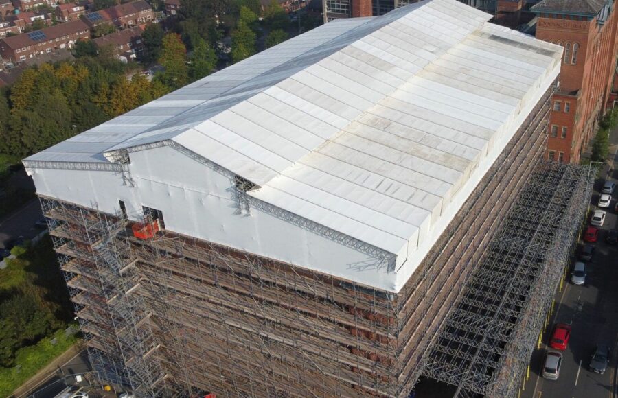 An aerial view of Houldsworth Mill's roof covered in scaffolding.