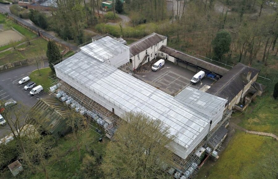 An image of 'The Stables' covered in scaffolding.