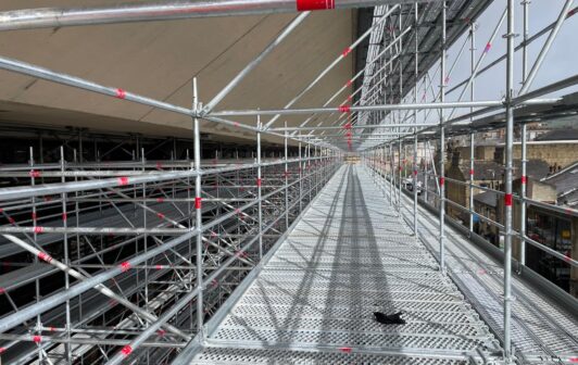 An image of the Trinity Building in Halifax covered in scaffolding.