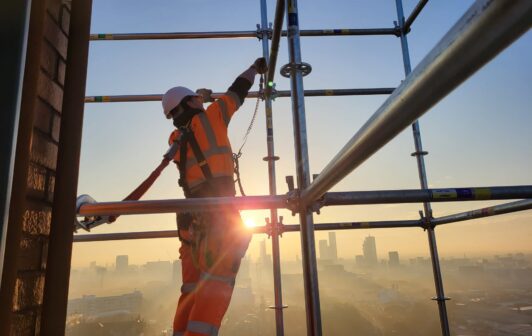 An image of Thorn Court in Salford, covered in scaffolding.