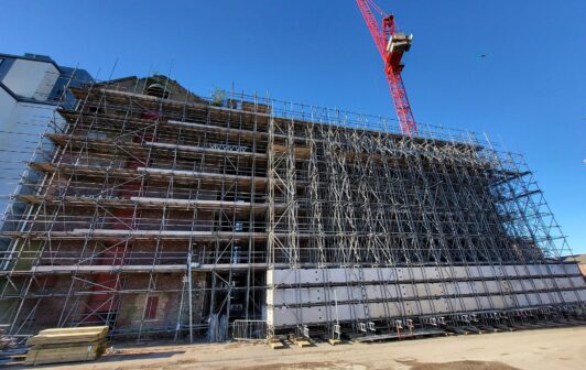 An image of Heaps Mill in Liverpool covered in scaffolding.